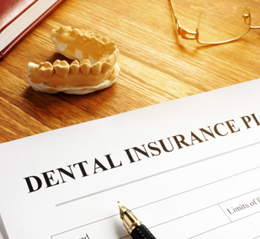 Parent in Rockwall reviewing dental insurance benefits